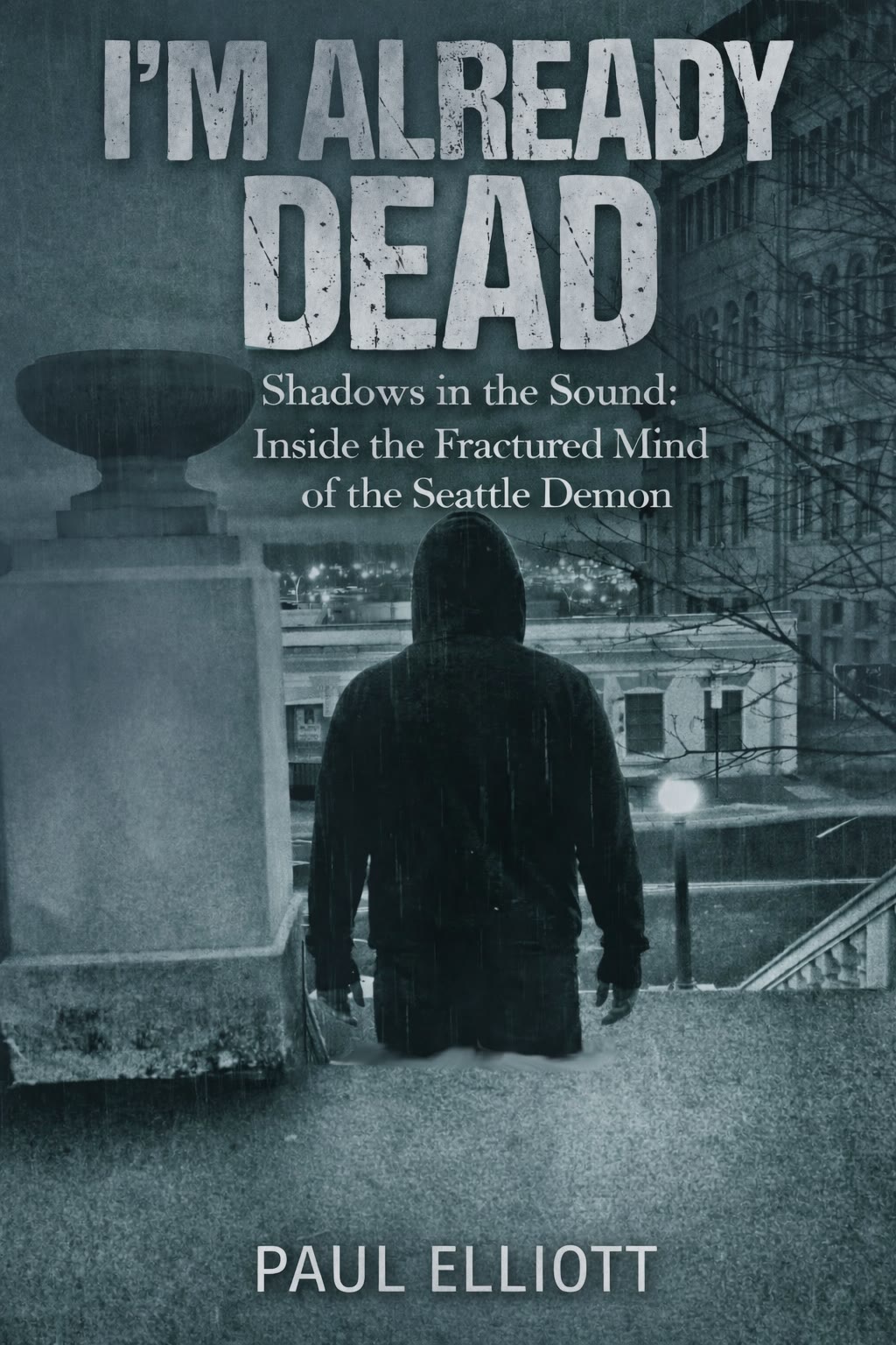 Book cover for I'm Already Dead by Paul Elliott, showing a hooded figure standing over a rain-soaked Seattle overlook at night